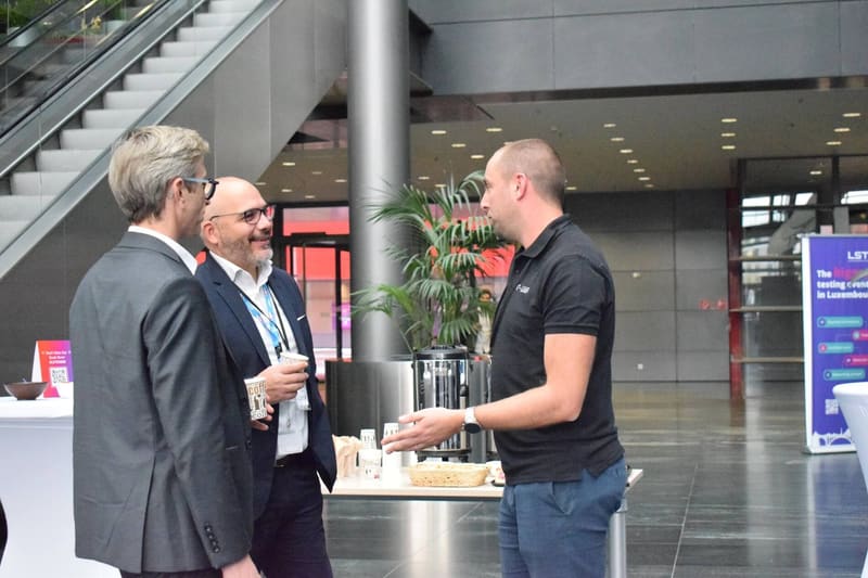 Attendees in conversation at LSTE