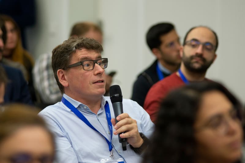 An attendee asking a question during a session at LSTE