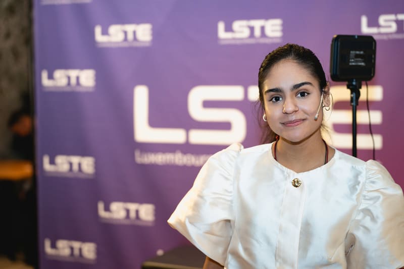 Master of Ceremonies Avanti Sharma on stage at LSTE 2025