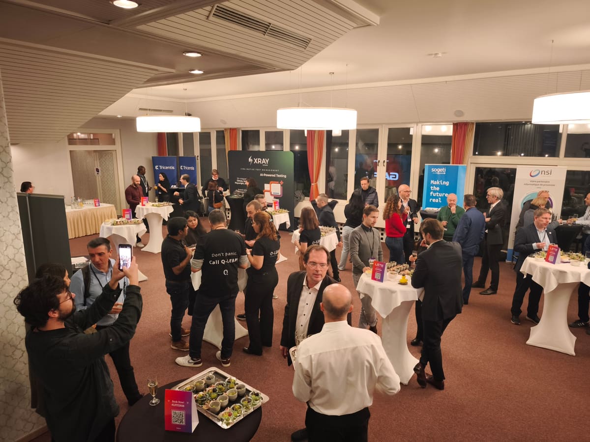 Evening networking reception at LSTE 2025, with sponsor booths in the background