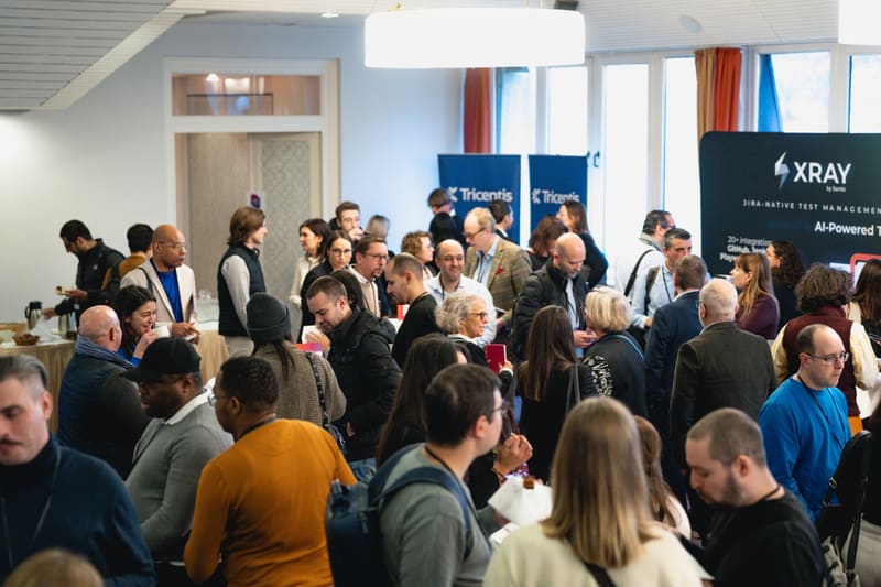 Attendees gathered around sponsor booths on the exhibition floor at LSTE 2025