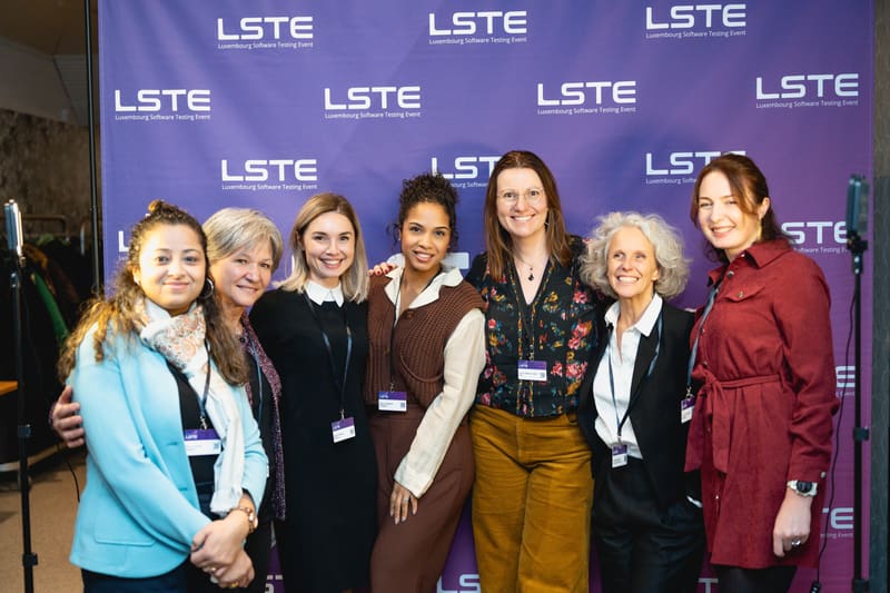 Women in testing posing together at LSTE 2025