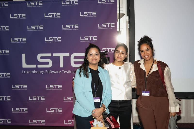 Three women in testing networking at LSTE 2025